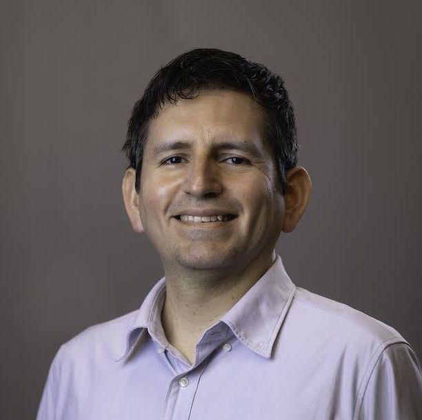 A photo of Fernando López smiling and looking at the camera.