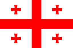 The flag of Georgia has a white field with a large centered red cross that extends to the edges and divides the field into four quarters. A small red Bolnur-Katskhuri cross is centered in each quarter.