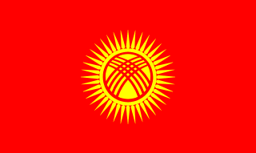 The flag of Kyrgyzstan features a yellow sun with forty rays at the center of a red field. At the center of the sun is a stylized depiction of a tunduk.