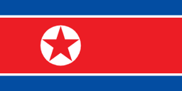 The flag of North Korea is composed of three horizontal bands — a large central white-edged red band, and a blue band above and beneath the red band. On the hoist side of the red band is a red five-pointed star within a white circle.