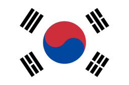 The flag of South Korea has a white field, at the center of which is a red and blue Taegeuk circle surrounded by four black trigrams, one in each corner.
