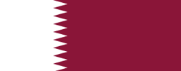 The flag of Qatar has a maroon field, on the hoist side of which is a white vertical band that spans about one-third the width of the field and is separated from the rest of the field by nine adjoining fly-side pointing white isosceles triangles that serve as a serrated line.